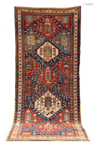 Kazak. Circa 1900. Even pile, small area of loss, 2 small holes. 9' 6