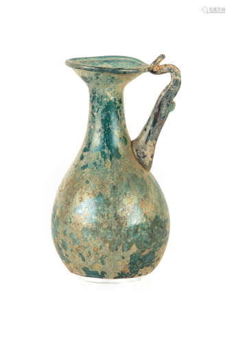 Roman Glass Ewer. with blue-green coloration and iridescence. Ht. 5