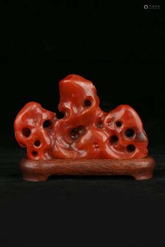 A CARVED RED AGATE  PEN REST.