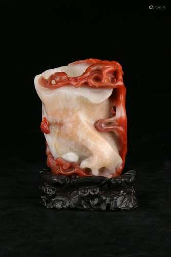 A CARVED RED-AGATE FLOWER STAND