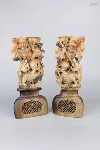 A PAIR OF CARVED SOAPSTONE CANDLESTICKERS.