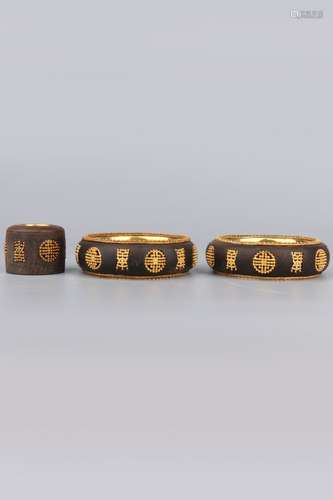 THREE OF GOLD-INLAID ALOESWOOD BRACELETS AND ARCHER