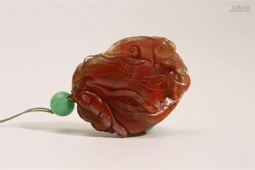 A CARVED RED-AGATE PENDANT.ANTIQUE