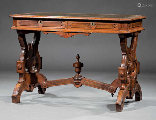 American Renaissance Carved Walnut and Burl Library Table , 19th c., inset green leather top, two