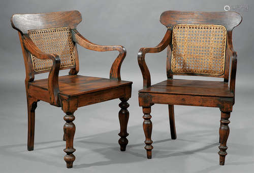 Pair of Anglo-Colonial Carved Tropical Hardwood Armchairs , 19th c., shaped crest rail, caned