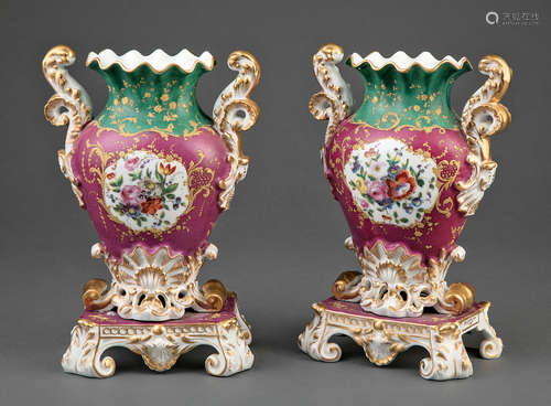 Pair of Paris Polychrome and Gilt Porcelain Urns , 19th c., with floral reserves on claret