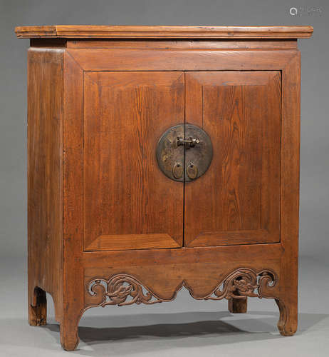 Chinese Brass-Mounted Carved Wood Cabinet , 20th c., waisted rectangular top, two doors, void