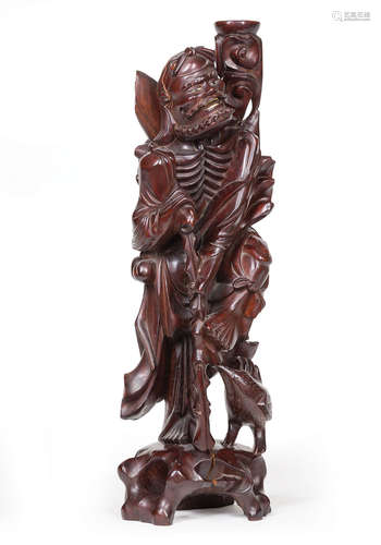 Chinese Hardwood Figure of a Luohan , carved leaning on a staff beside a bird at his feet with a