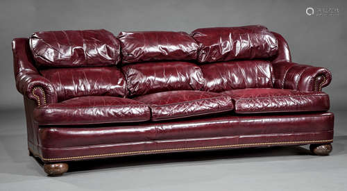 Contemporary Leather Sofa , fixed cushioned back, three loose seat cushions, concave base, bun feet,