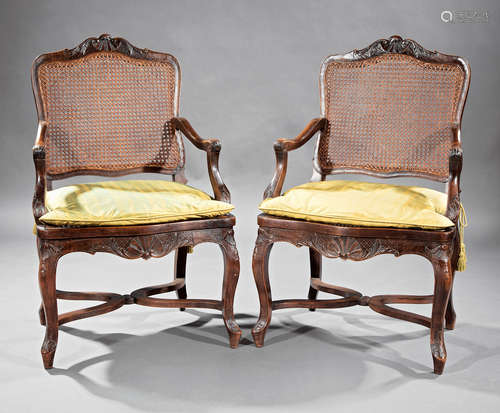 Pair of Antique Provincial Louis XV Carved Walnut Fauteuils , 18th c., diapered shell and scroll