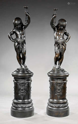 Pair of Large Continental Patinated Bronze Figural Torcheres , 20th c., in the Egyptian taste,