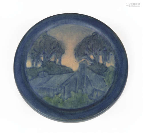 Newcomb College Art Pottery Plaque , decorated with low relief-carved cabin and trees design,