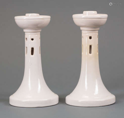 Pair of Newcomb College Art Pottery Candlesticks , decorated with geometric cut-outs, white high