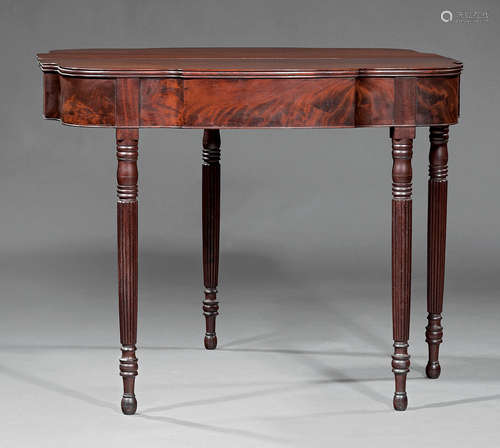 American Classical Carved Mahogany Games Table , early 19th c., Philadelphia, shaped fold-over