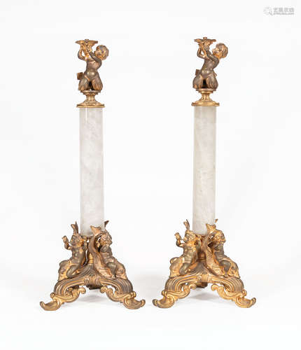 Pair of French Rock Crystal and Bronze Figural Candlesticks , c. 1900, surmounted by a Merbaby,