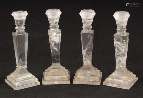 Four Neoclassical-Style Rock Crystal Candlesticks , 20th c., tapered standard, on stepped base ,