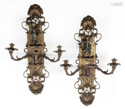 Pair of Regence-Style Gilt Bronze Three-Light Wall Sconces , foliate shell crests, backplates