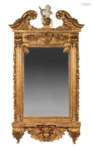 Pair of Italian Rococo-Style Carved and Gilded Mirrors , broken-arch cornice centered by a composite