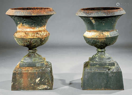 Pair of American Cast Iron Garden Urns , 19th c., bird motif, associated plinth base, h. 24 3/4 in.,