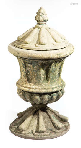 American Cast Stone Covered Urn , 19th c., flame finial, fluted body, reeded top and base, h. 43