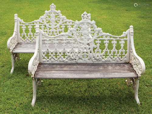 Pair of American Cast Iron Benches , 19th c., gothicized motifs, wood slatted seat, h. 36 1/2 in.,