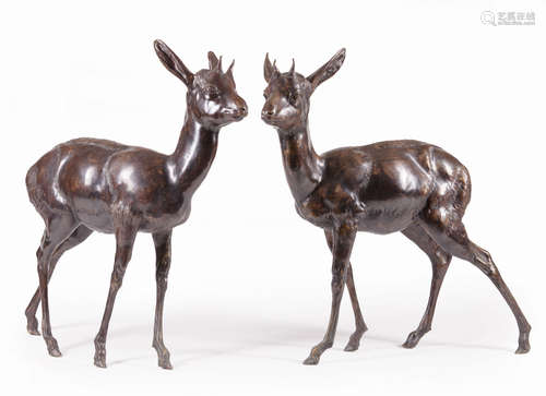 Pair of Bronze Fawns , h. 26 in., w. 24 in., d. 7 in. each . Provenance: Estates of George and