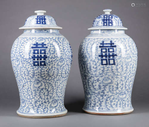 Near Pair of Chinese Blue and White Porcelain Covered Jars , 19th c., decorated with double