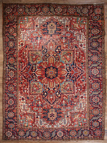 Antique Persian Carpet , red ground, blue border, central medallion, overall stylized floral design,