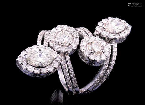 18 kt. White Gold and Diamond Four Row Ring , 2 marquise cut and 2 round brilliant cut diamonds,