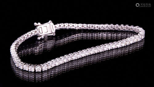 14 kt. White Gold and Diamond Tennis Bracelet , 64 prong set round brilliant cut diamonds, total wt.