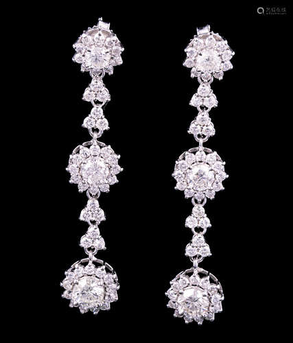 Pair of 18 kt. White Gold and Diamond Earrings , each set with 3 round diamonds, total wt. 2.79