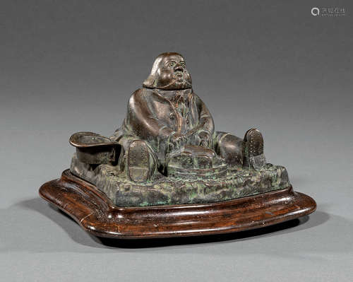 American Bronze Figural Inkwell , 19th c., modeled as portly man with tray of roasted turkey, wood