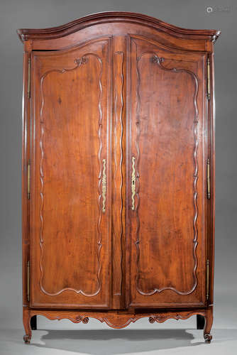 Louis XV Provincial Cherrywood Armoire , 18th c., serpentine cornice and paneled doors, shaped apron