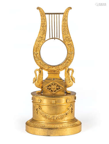 Empire Gilt Bronze Watch Holder , early 19th c., harp form flanked by swans, oval base, h. 10 1/2