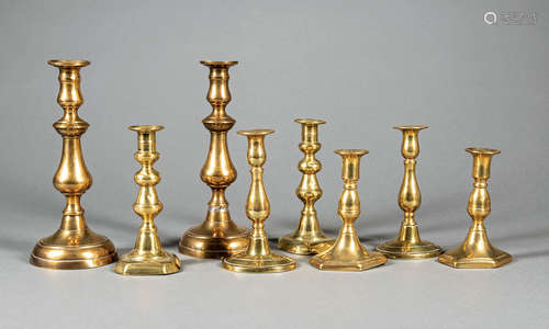 Four Pairs of English Turned Brass Candlesticks , 19th c., h. range from 6 1/8 in. to 10 1/2 in. (