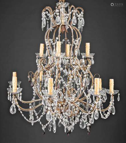 Pair of Continental Gilt Metal and Crystal Twelve-Light Chandeliers , scrolling arms with cut