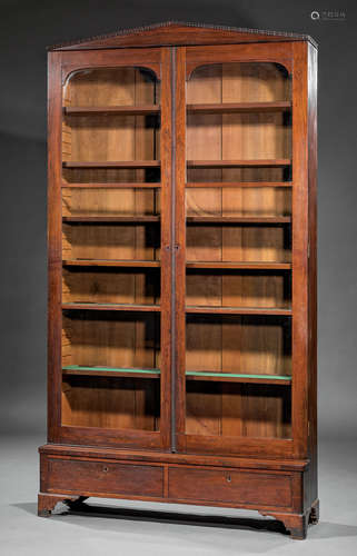 American Late Classical Rosewood Bookcase , c. 1840, ripple molded pediment, glazed doors, shelf