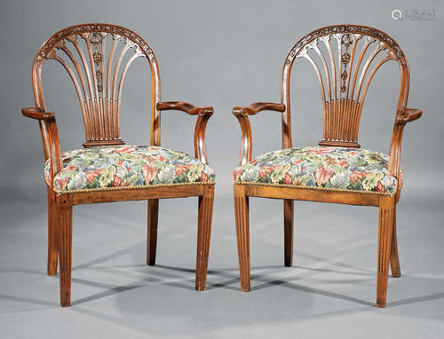 Pair of Adam-Style Carved Mahogany Armchairs , 20th c., bellflower-carved fan back, scrolled