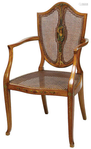 Edwardian Painted Satinwood Armchair , c. 1900, shield-back centered by a maiden reserve, caned back