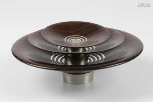 John Wessels (South Africa) striped ebony and pewter nest of three bowls 5x15, 3x13 and 2x8cm.