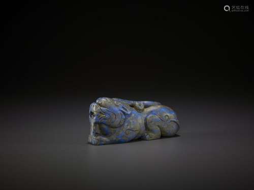 A LAPIS LAZULI CARVING OF A LION DOG, QING