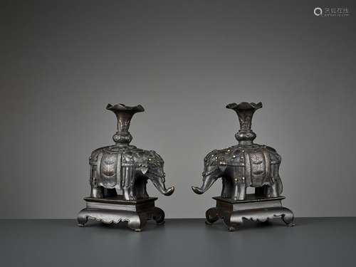 A PAIR OF CAPARISONED ELEPHANT BRONZES