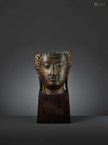 AN IMPRESSIVE AND LARGE BRONZE BUDDHA HEAD