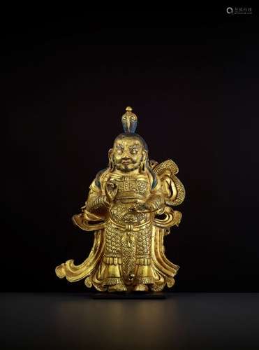 A GILT COPPER GUARDIAN KING, TIBET 17TH CENTURY