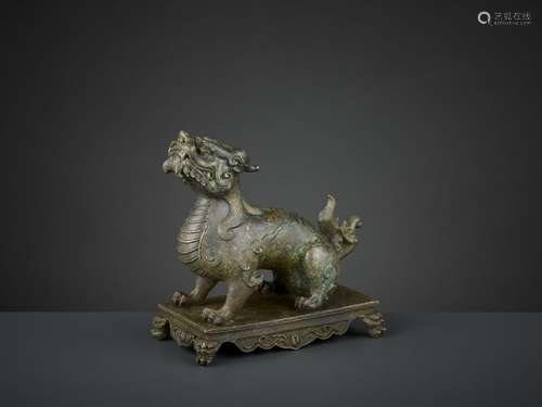 A BRONZE FIGURE OF A QILIN, QIANLONG SIX CHARACTER…