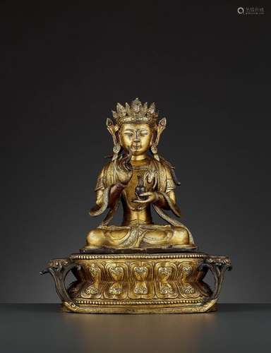 A LARGE FIRE GILT BRONZE AVALOKITESHVARA, MING