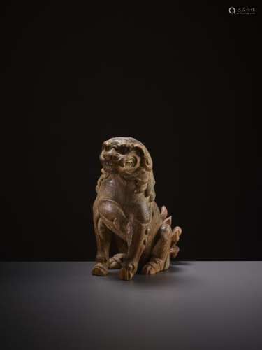 A CARVED WOOD BUDDHIST LION, SONG