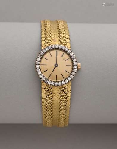 Montre de dame à bracelet et boitier en or jaune 18K, le mouvement mécanique à [...]