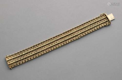 Large bracelet à mailles souples tressées en or jaune 18K.- Poids : 52,3 g.- L. [...]