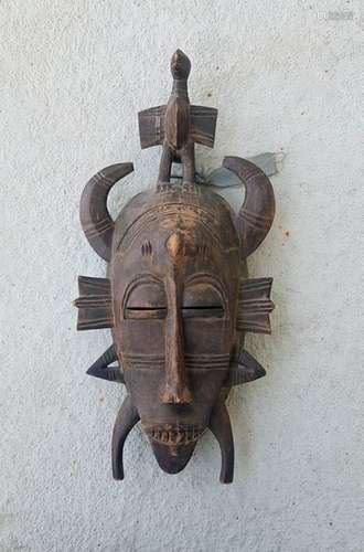 Masque africain Senufo surmonté d'un oiseau \n41 cm